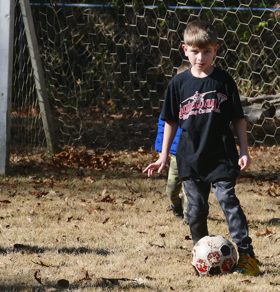 Student Playing Soccer